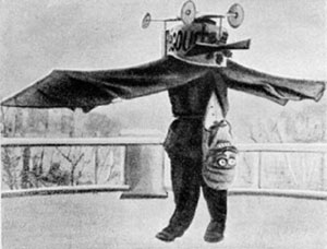 Вуд на маскараде изображает авиатора, перевернувшегося вверх ногами («Квантик» №8, 2019)